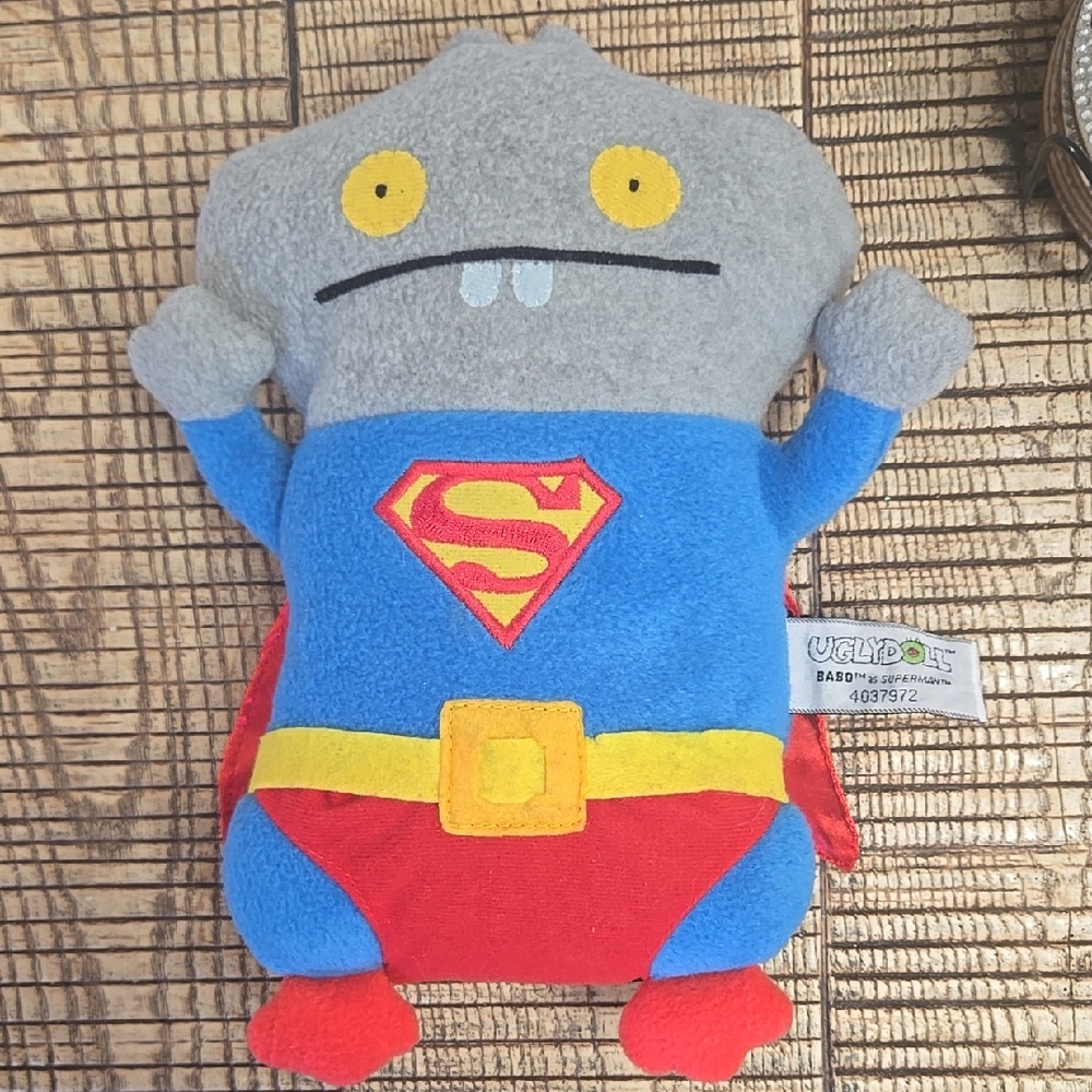 Gray and Blue Superhero Costume with Iconic Emblem